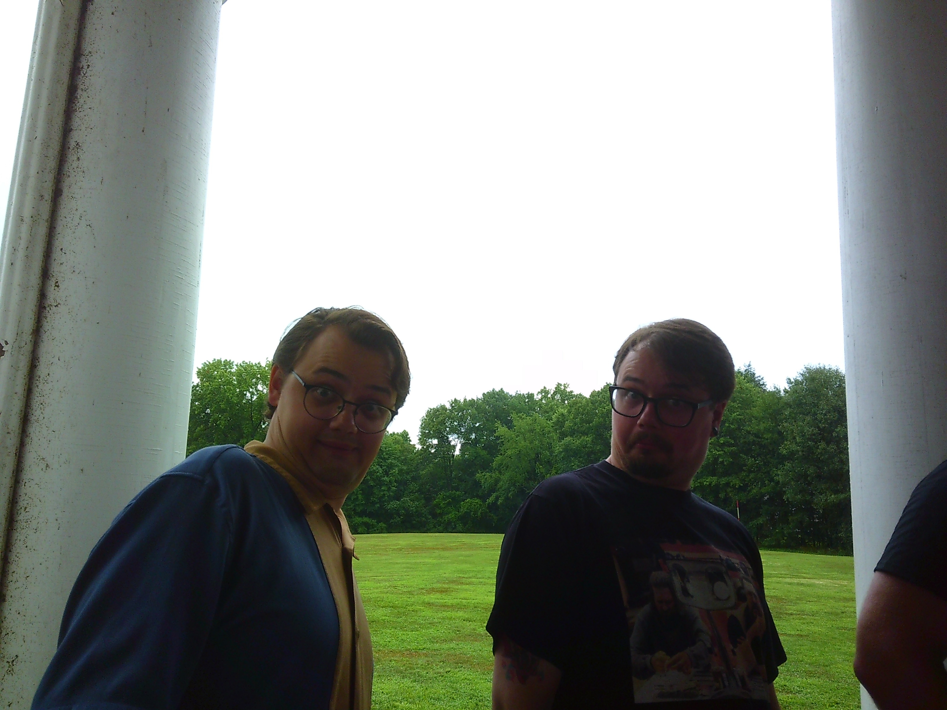 Photo of two identical men making a bit of a funny face towards the camera