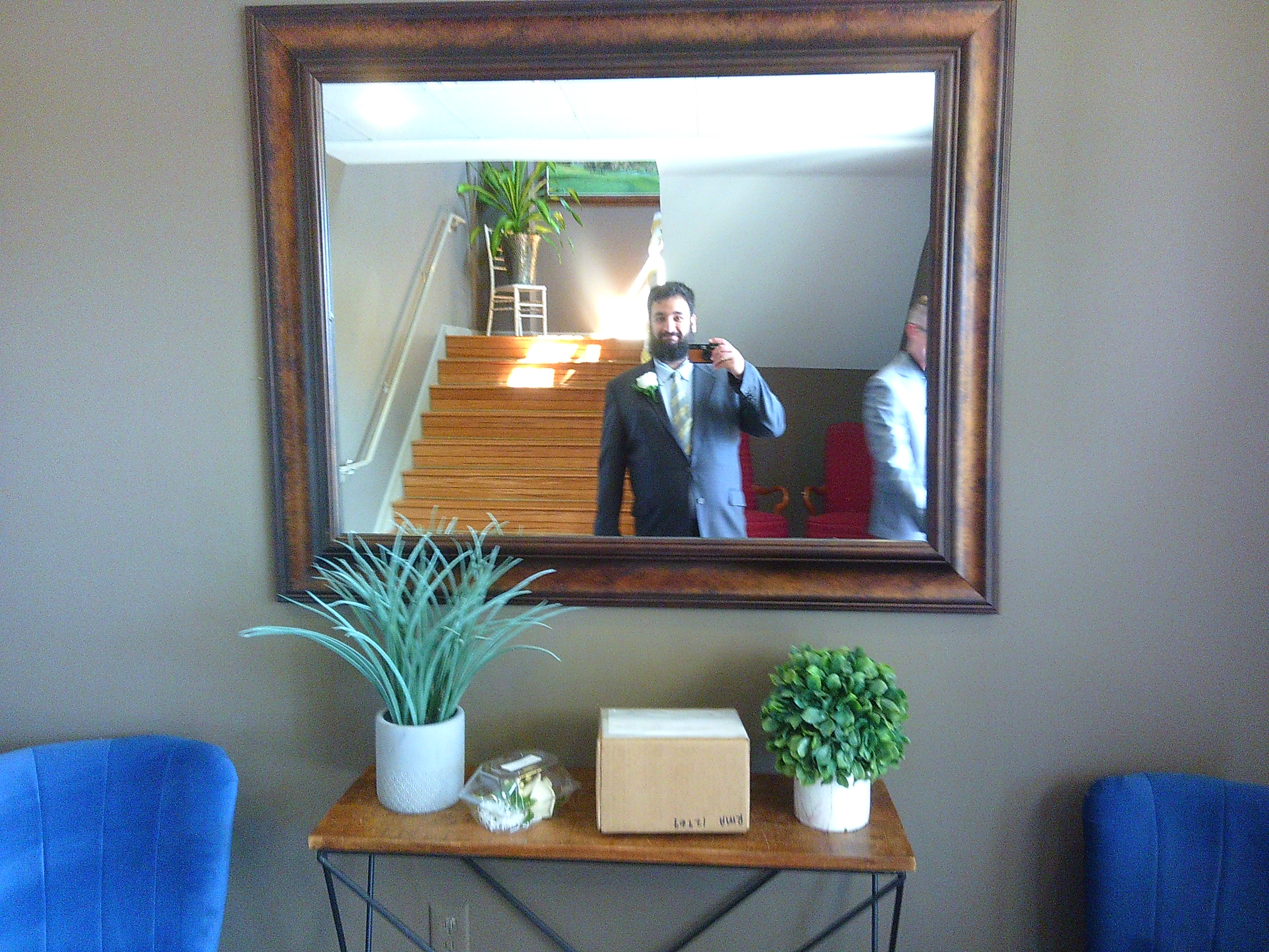 Photo of myself (a man with a beard) taking a selfie in a mirror. I'm wearing a dark blue blazer, light blue under shirt, and a green and yellow striped tie