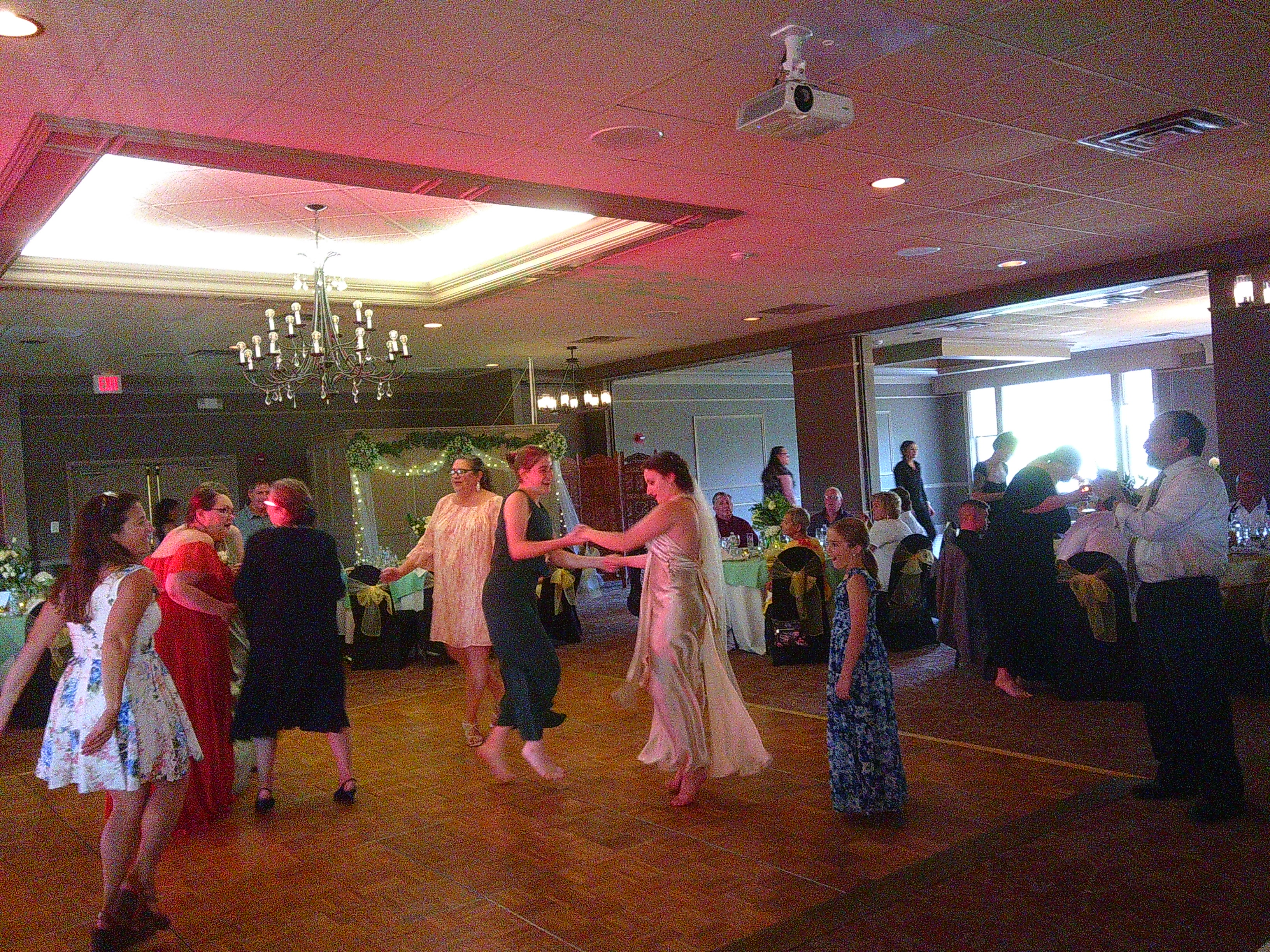 photo of a lot of people on the dance floor, but primarily the Bride (Zakiah) dancing with one of her cousins I believe