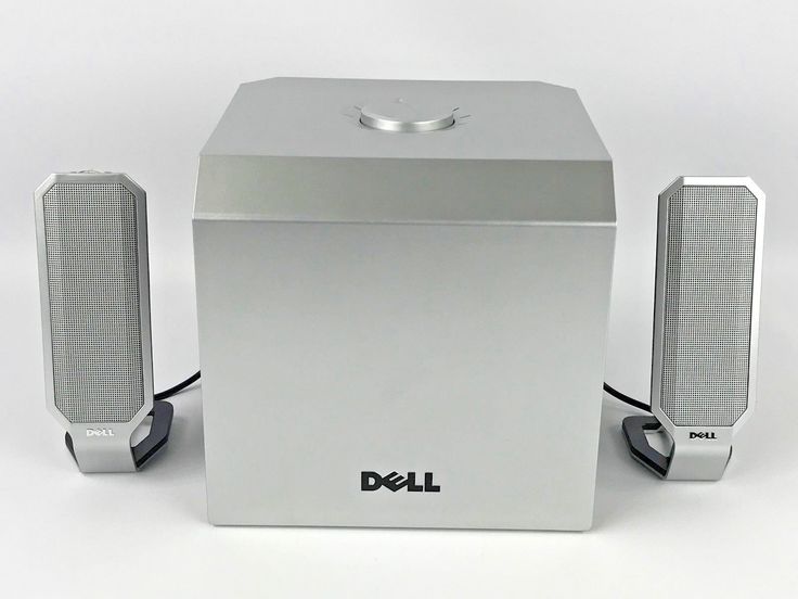 image of computer speakers with a subwoofer. They all say 'dell' on them and the subwoofer has a knob on top. 