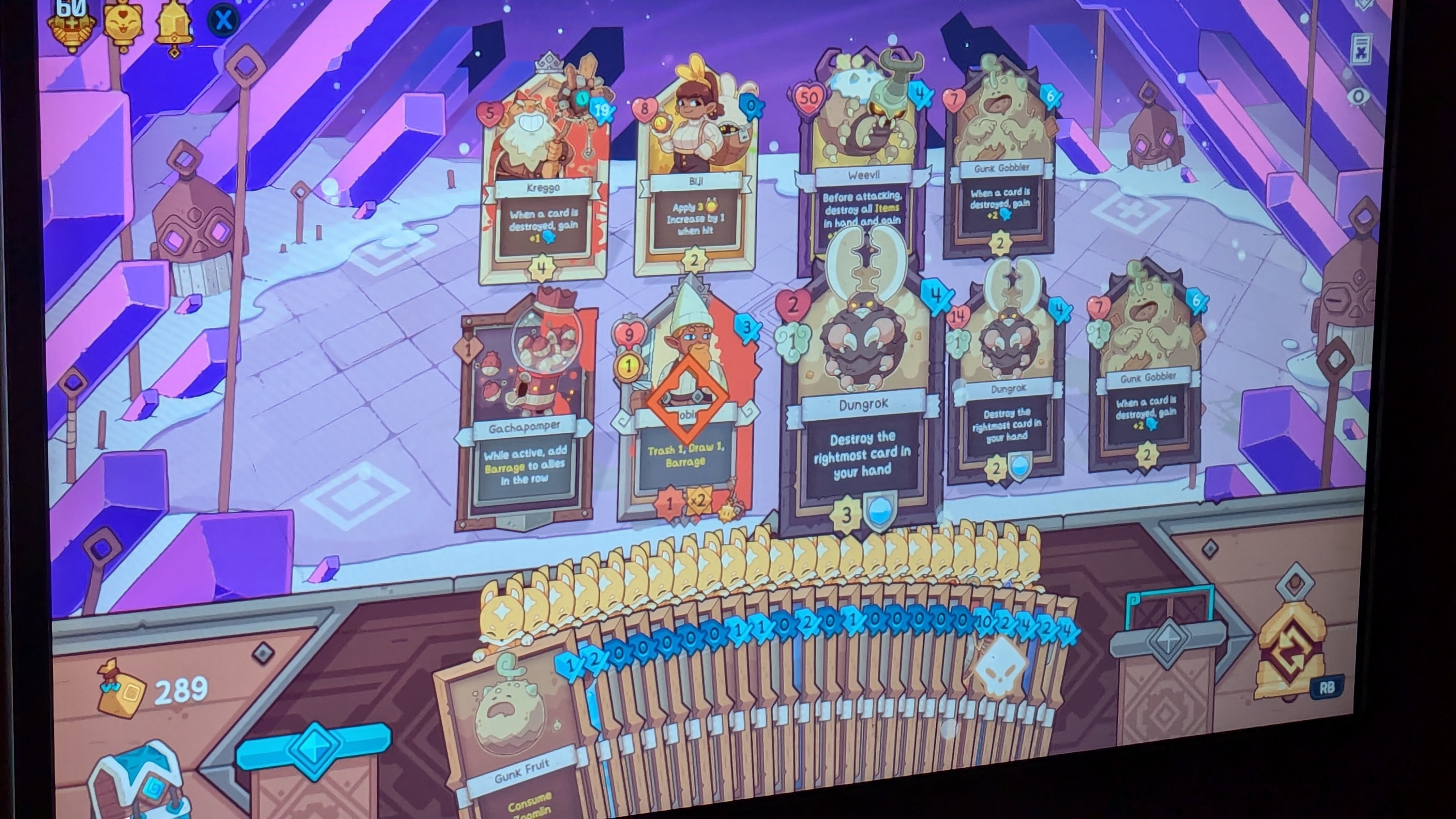 Photo of the game Wildfrost. There are a number of characters ont he screen, but the most notable thing is there are too many cards in hand to count. Each of them has a fox symbol over them to indicate it can be played without triggering end of turn