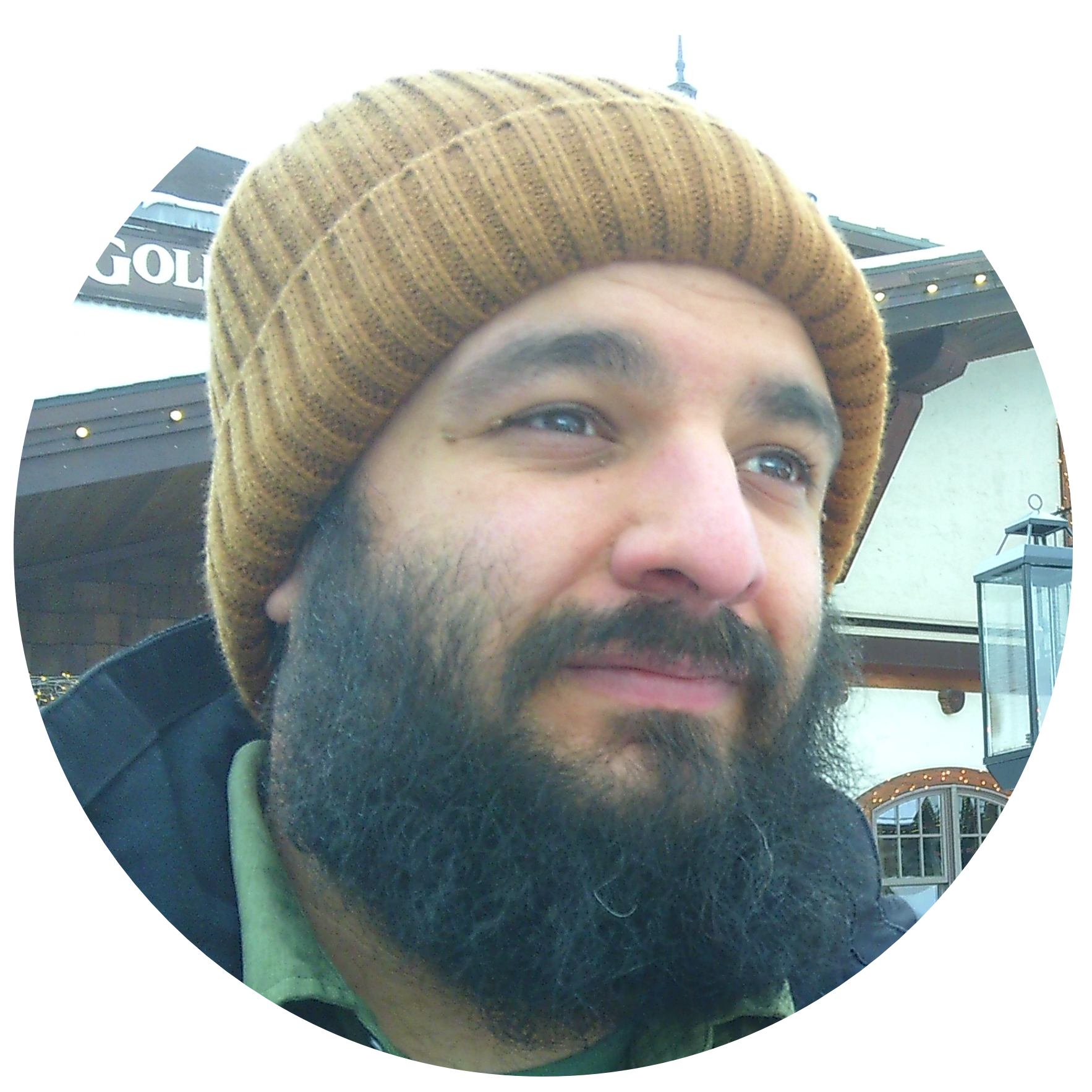 closeup of a bearded man with a brown beanie