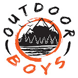 the Outdoor Boys YouTube channel logo. It features a drawing of a black and white mountain range with trees and a lake at it's base, surrounded by an orange circle. Around the orange circle, it says Outdoor Boys