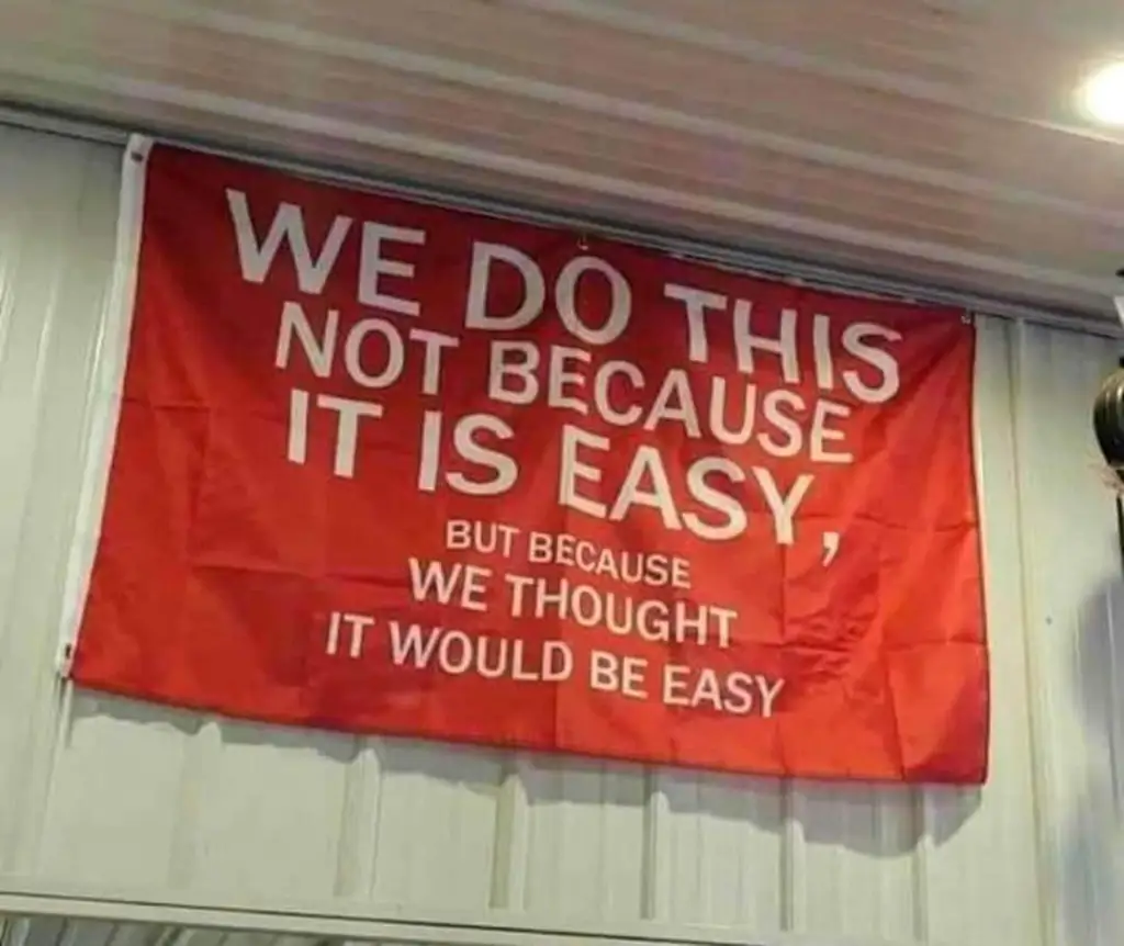 image of a flag that says we do this not because it is easy, but because we thought it would be easy