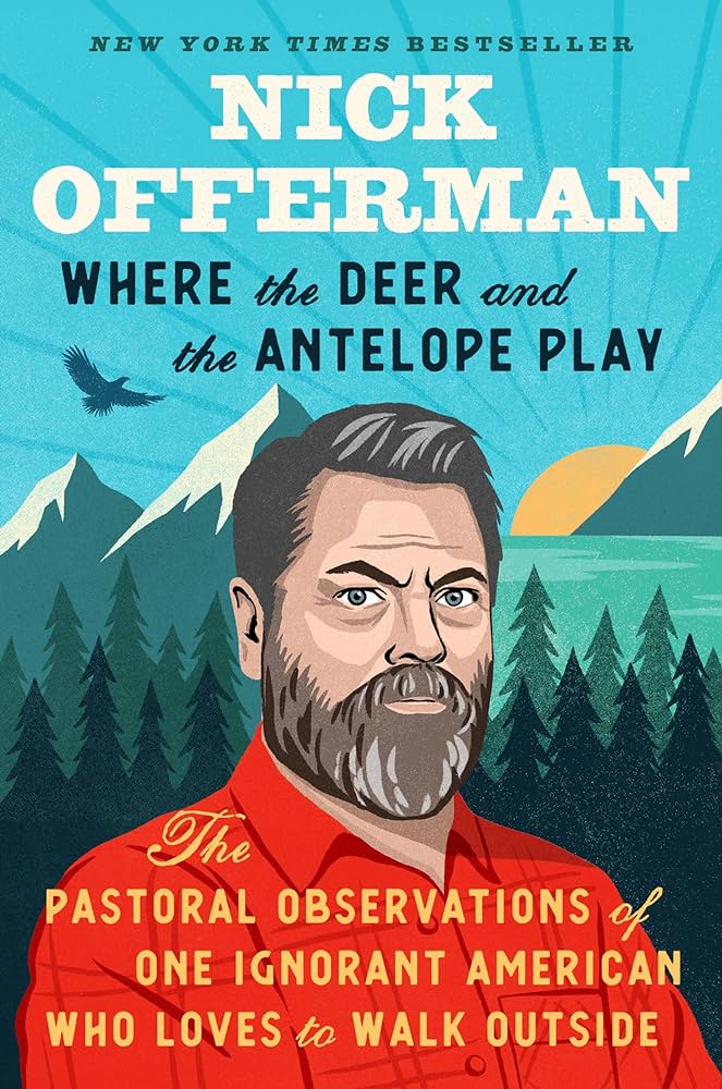 The cover of the book. It features a cartoonish drawing of the auther Nick Offerman in front of a background of trees, mountains, a lake, and the sun. There's also a bird flying in the air. Nick Offerman is wearing a red plaid shirt, and has greyish hair and full beard with mustache.